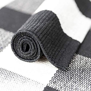 Classic cotton buffalo plaid rug with soft texture, perfect for any modern home décor.