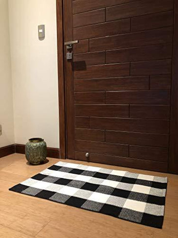 Durable and cozy cotton buffalo plaid rug, ideal for adding style to living rooms and bedrooms.