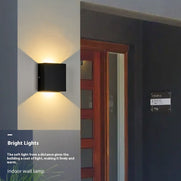 Waterproof LED wall lamp with white or warm light for outdoor use.