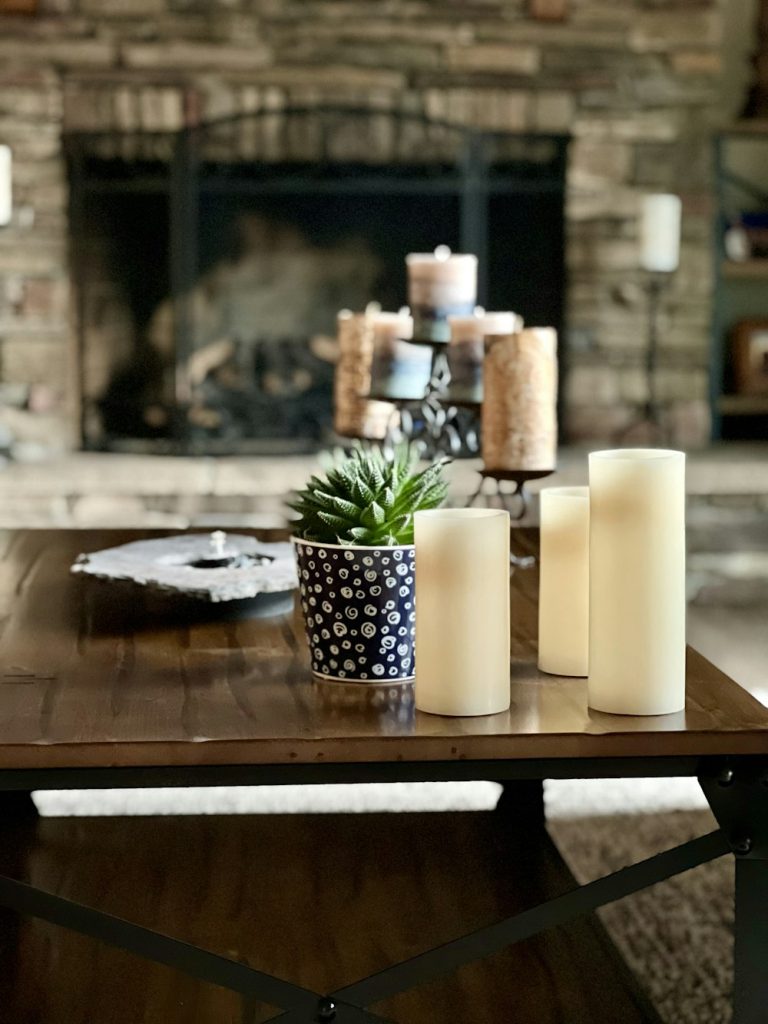 Table styled with candles and a small plant