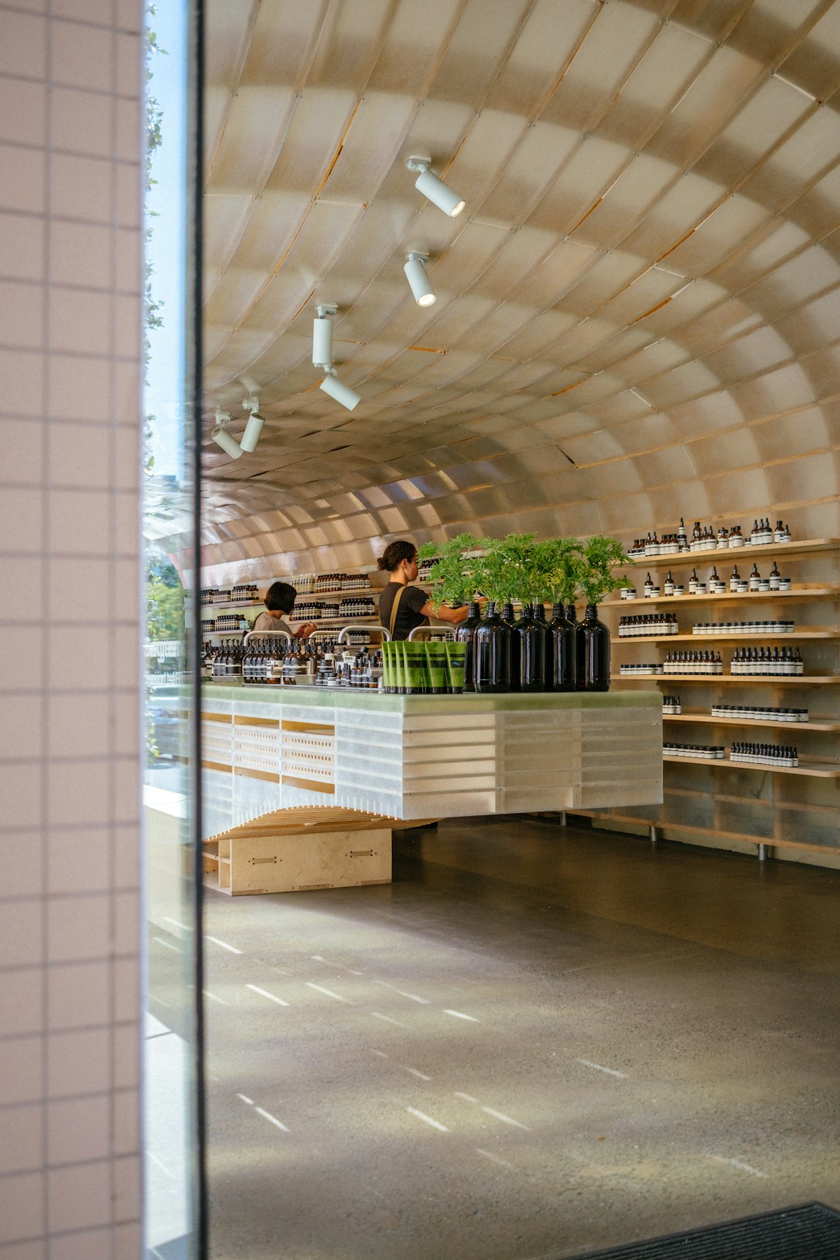 Retail store with a wooden arched ceiling and display shelving