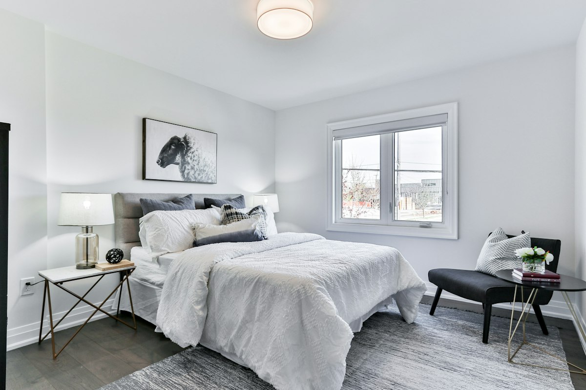 Calm bedroom with crisp white bed linen