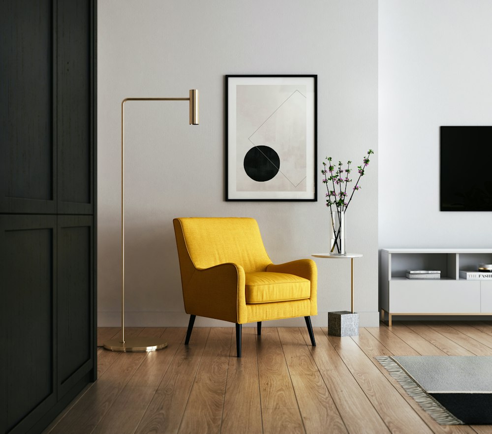 Mustard armchair beside a sideboard in a white living room